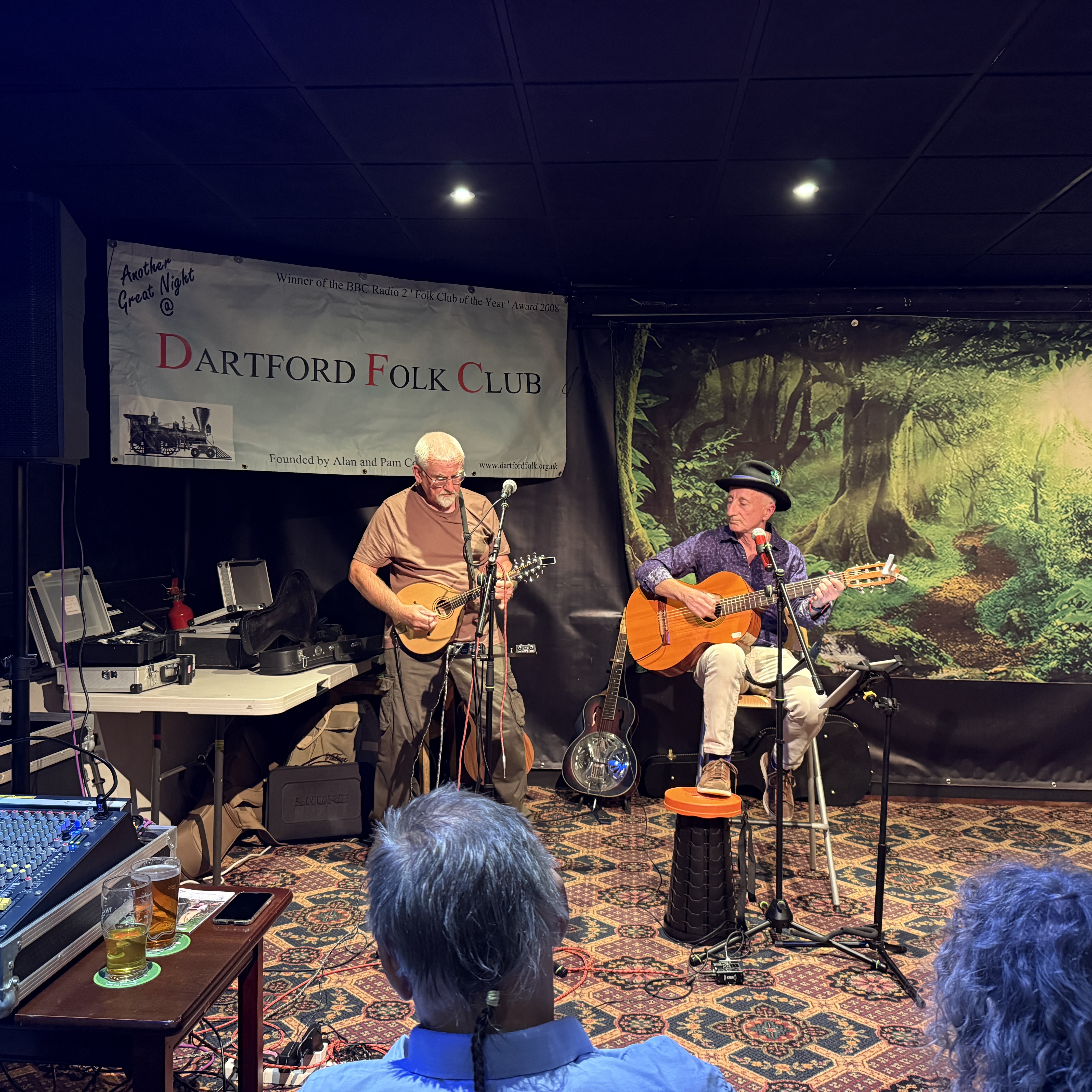 Dartford Folk Club musicians performing beneath the club banner